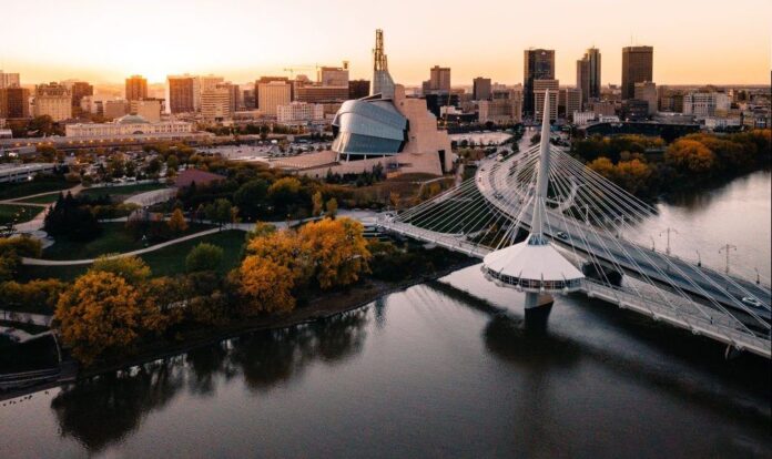 Winnipeg skyline featuring the Provoncher Bridge/Louis Riel Promenade and the Canadian Museum for Human Rights