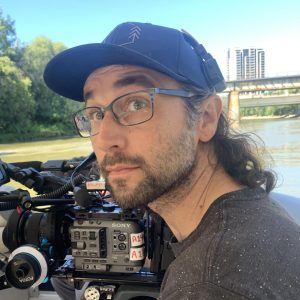 Ben holding a large film camera